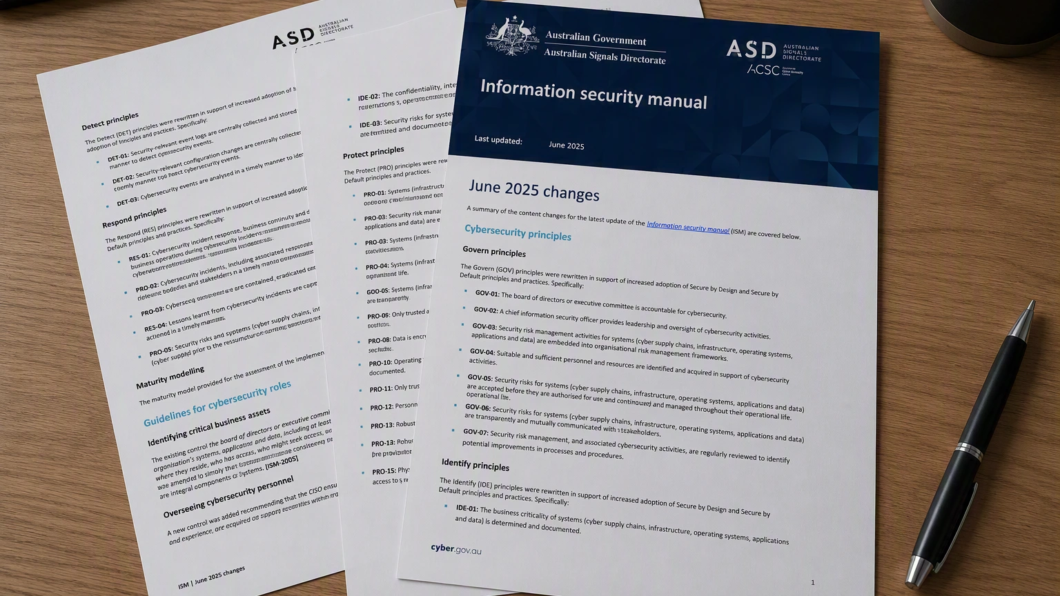 Printed pages of the ASD Information Security Manual on a desk